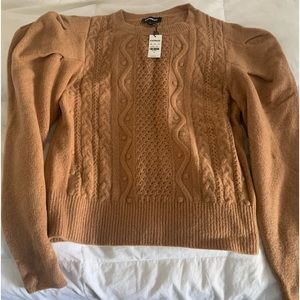 Nice tan sweater. Shoulder sleeves. Great look with jeans and cozy. Nee